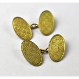 A pair of vintage 1920s 9ct gold oval cufflinks with engine turned chequerboard design,