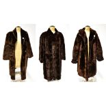 Three vintage simulated fur coats comprising a mink-style velour coat with wide collar,