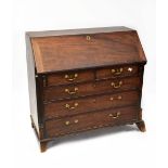 A George III mahogany bureau, the fall front enclosing a fitted interior,