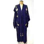 A navy blue silk kimono embroidered with peonies and trailing stems to the front and sleeves,