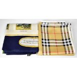 BURBERRY; two vintage silk scarves comprising one in distinctive Burberry check,
