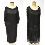 Two 1920s dresses comprising a black silk chiffon jet beaded sleeveless dress with scalloped hem,