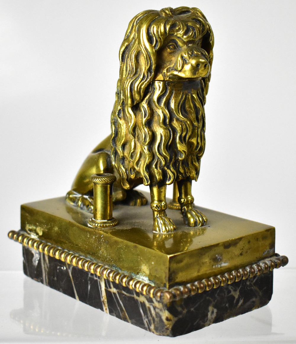 A late 19th century French brass inkwell and quill holder, modelled as a Lowchen/poodle dog,