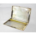 A George VI hallmarked silver engine turned cigarette case, London 1941, length 12.5cm, approx 5.