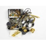 A small collection of vintage and modern costume jewellery to include some small pieces of gold and