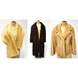 Three vintage furs comprising a circa 1960s caramel mink waist-length swagger jacket with flared