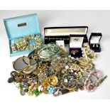 A good quantity of vintage and antique costume jewellery to include brooches, charm bracelets,