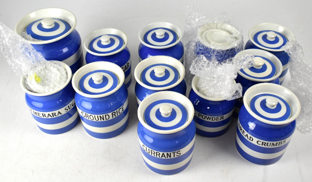 T G GREEN; a collection of twelve Cornish ware blue and white striped lidded kitchen jars,