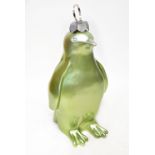 A large fibreglass model of a penguin bauble in chartreuse green,