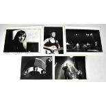 Two black and white photographs bearing signatures, Michelle Shocked and Mud,