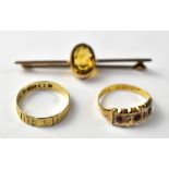An Edwardian 15ct yellow ring set with three small rubies and two small diamonds, size L1/2,