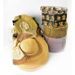 Four vintage hat boxes to include a Marshall & Snelgrove black floral box containing a 1930s