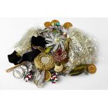 A quantity of costume jewellery to include brooches, necklaces, white metal items, etc.