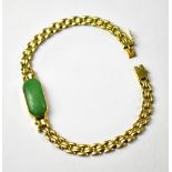 An 18ct gold Chinese-style bracelet set with green jade panel, on square link chain,