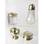 Two cut glass dressing table pots with hallmarked silver tops, marks rubbed,