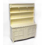 An early 20th century white painted dresser,