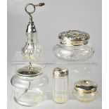 Four items of cut glass and hallmarked silver topped dressing table items to include a round box
