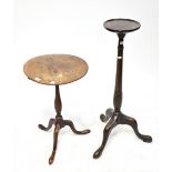 A 19th century mahogany torchère stand supported on a turned upright and on tripod cabriole base,