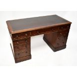 A Victorian mahogany twin pedestal desk with leather inset top over one long drawer and each