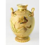 ROYAL WORCESTER; a twin-handled blush ware vase of globular form,