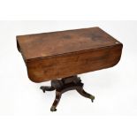 A Regency mahogany Pembroke table with D-end leaves above a single frieze drawer,