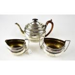 A George III hallmarked silver three-piece tea service, comprising teapot, height 17.