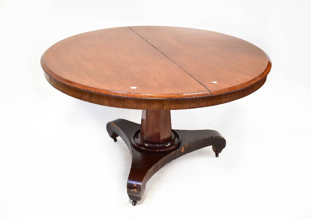 A 19th century mahogany circular tilt-top breakfast table with hexagonal column and raised on