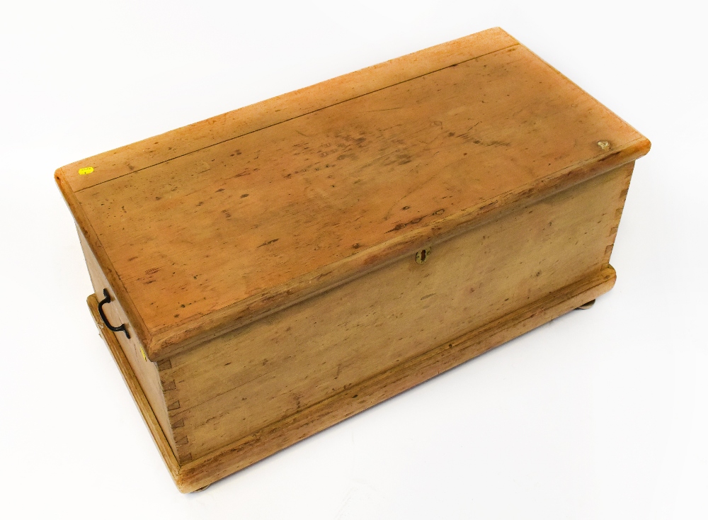 A late 19th/early 20th century pine bedding box, on later bun feet, 44 x 97 x 46cm.