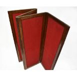 A late 19th century mahogany four-panel screen, each panel upholstered with a red felt material,