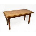 An early 20th century oak dining table raised on tapering square section supports, 79 x 146 x 73cm.
