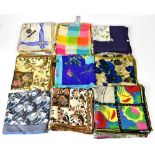 A group of ten vintage silk scarves to include a Pierre Cardin example of navy ground with al-over