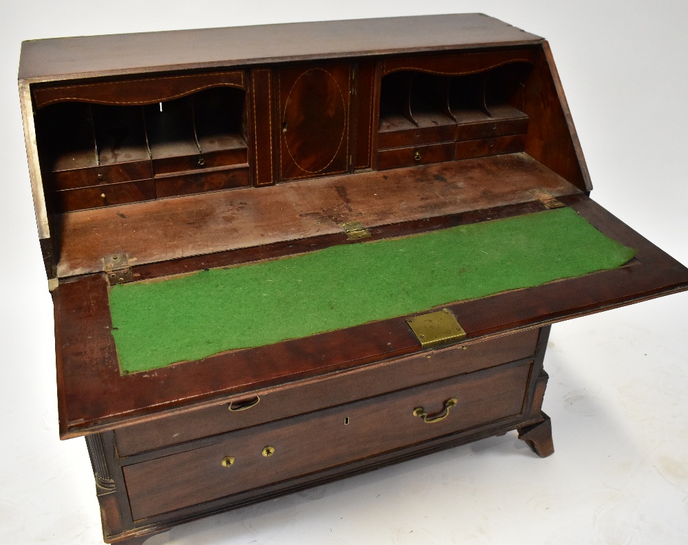 A George III mahogany bureau, the fall front enclosing a fitted interior, - Image 4 of 7