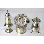 Two non-matching hallmarked silver pepper pots, a single engine turned silver napkin ring,