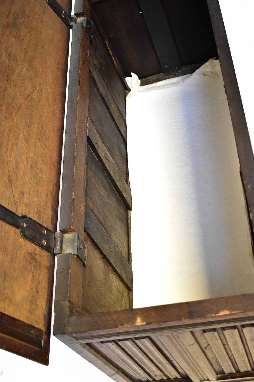 An early 20th century oak blanket box with hinged lid above four panels to the front and two panels - Image 2 of 2