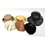 Three vintage circa 1950s and 60s mink fur hats comprising one dark brown example with brown