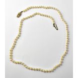 A 9ct gold mount seed pearl necklace, the clasp with pierced circles and ropetwist decoration,