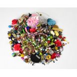 A quantity of costume jewellery to include necklaces, etc.