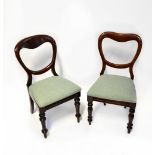A set of six Victorian mahogany balloon back dining chairs with drop-in seats,