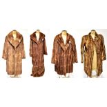 Four vintage fur coats comprising a camel and brown striped fur coat with short collar,