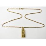 A 9ct gold ingot pendant with an enlarged hallmark to the front,