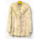 A lynx dyed white fox fur jacket,