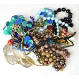 A quantity of costume jewellery to include an enamel articulated fish necklace, etc.