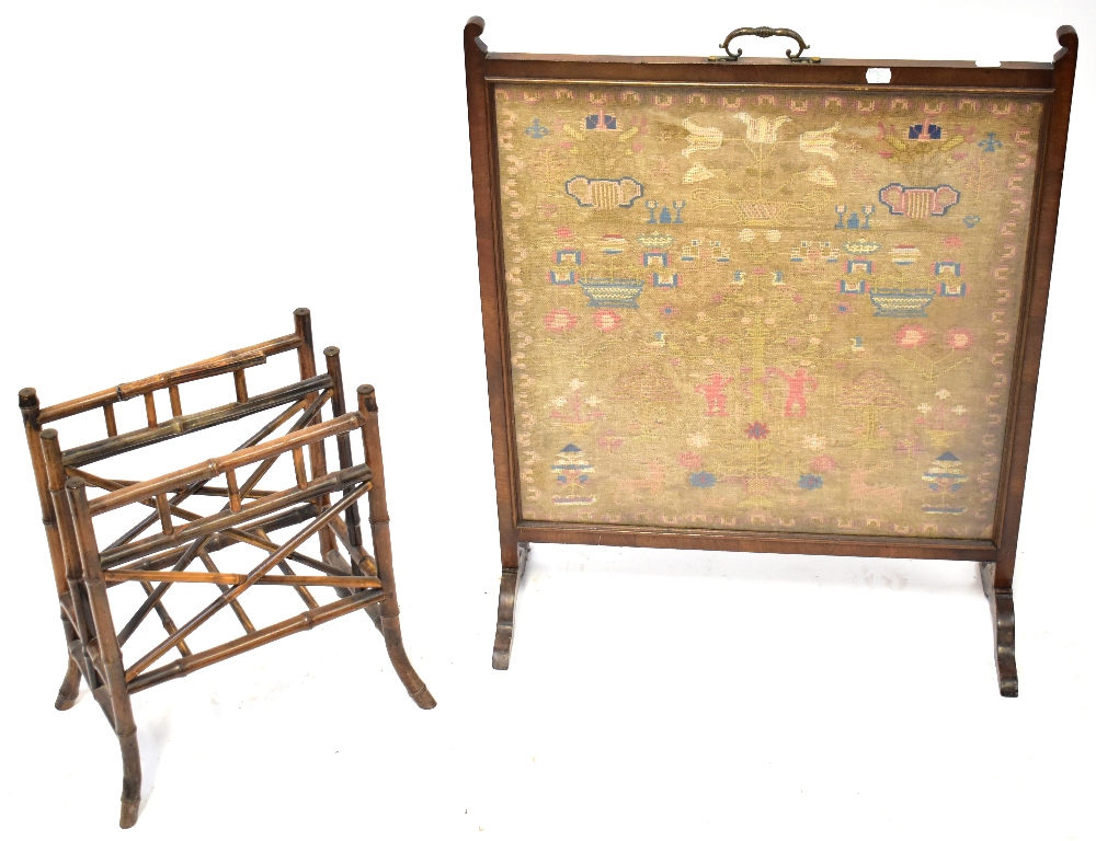 A 19th century mahogany framed fire screen inset with a needlework panel depicting Adam and Eve