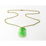 A 9ct yellow gold twist link chain necklace with a green jade pendant,