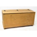 A very large, possibly bespoke made pine bedding box, the pine top with iron external hinges,