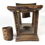 A 19th century African tribal wooden headrest, the curved top supported on four corner pillars,