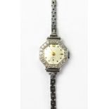 A ladies' vintage octagonal cocktail watch set with twenty-four small diamonds,
