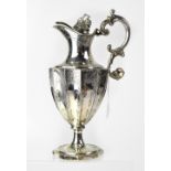 WITHDRAWN A George II hallmarked silver claret jug of baluster fluted form,