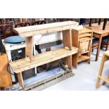 A near-pair of rustic stripped pine benches, the largest 53 x 133 x 25cm, the other 53 x 111 x 25cm,