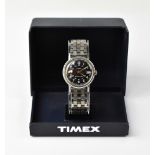 TIMEX; a stainless steel wristwatch,